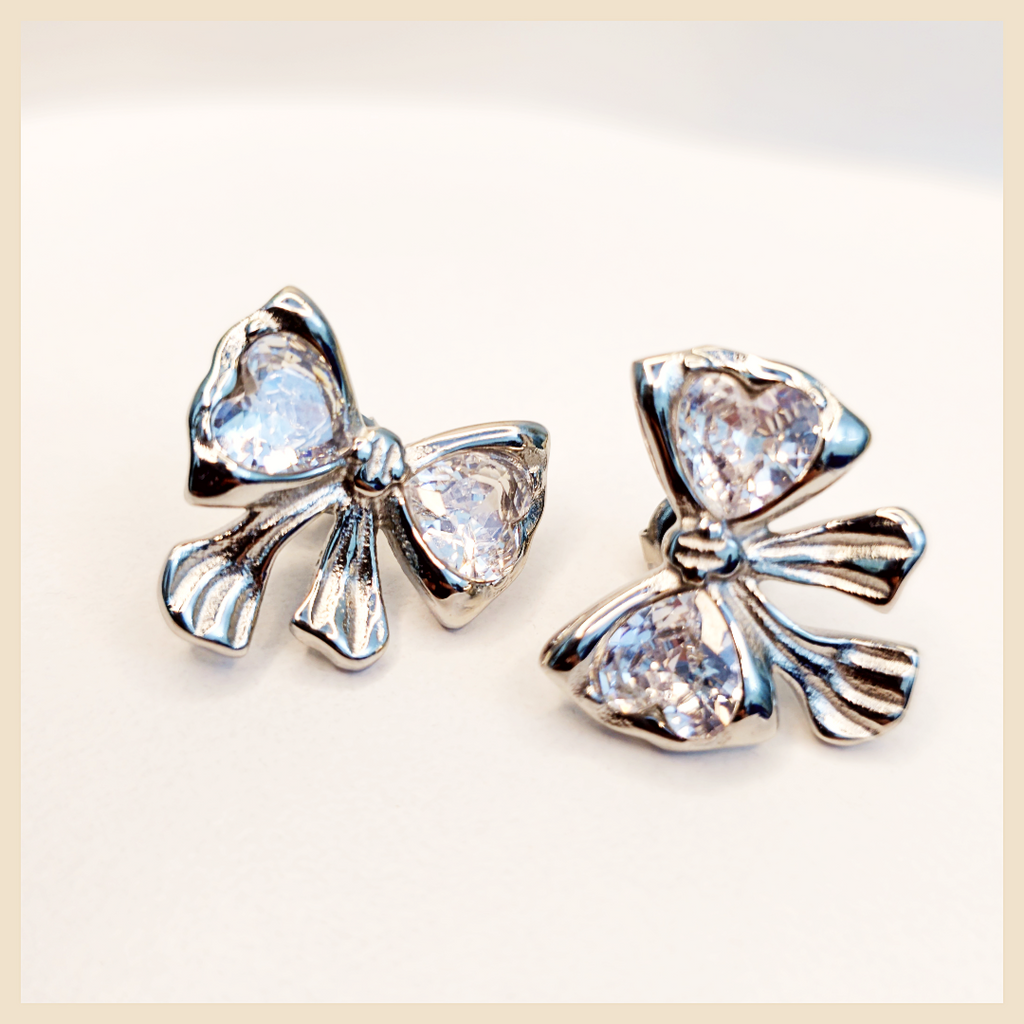 GOLD bow hoop earrings by Cadi, a beautiful birthday, wedding, or prom jewellery choice for women who want soft sparkle and timeless charm.