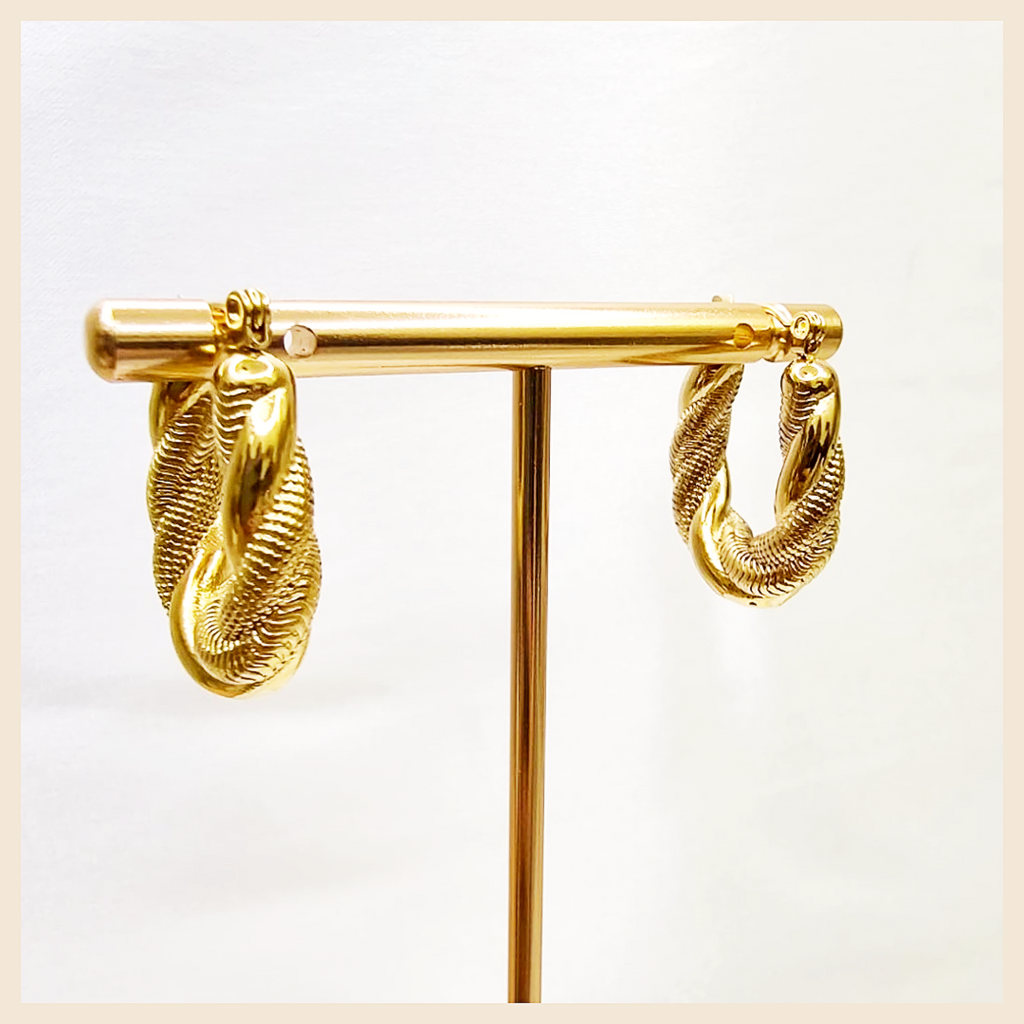 Arla lightweight silver twist hoop earrings for women, a versatile jewellery choice for all occasions with a chic silhouette that feels effortlessly sophisticated.