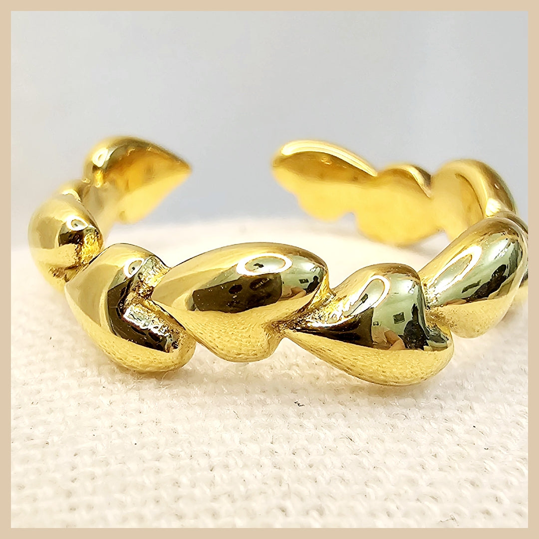 Chunky heart statement ring with smooth gold finish, crafted to express love and individuality through a fashionable, high-end design.