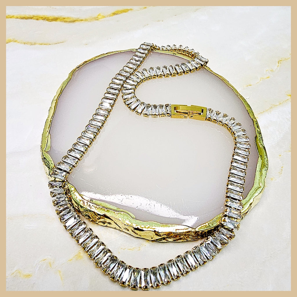 Classic cubic zirconia tennis necklace in gold plating, offering a polished look that transitions effortlessly from daily wear to evening occasions.