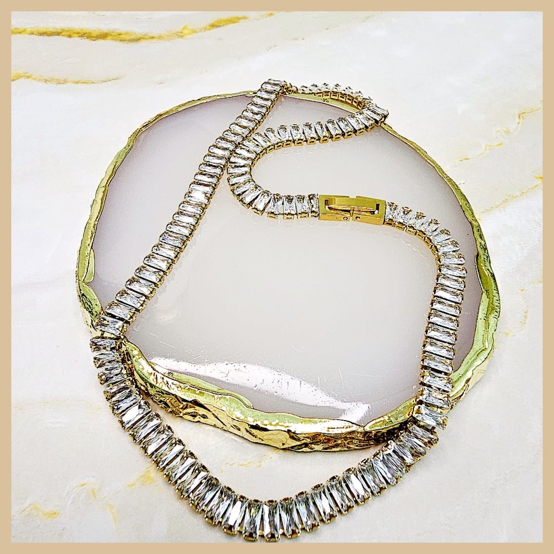 Classic cubic zirconia tennis necklace in gold plating, offering a polished look that transitions effortlessly from daily wear to evening occasions.