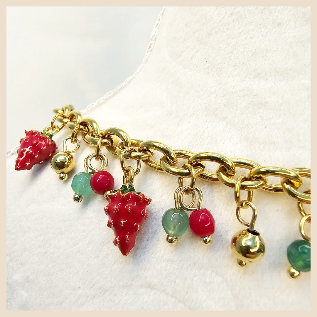 Cute strawberry and pearl bow necklace blending playful charm with premium craftsmanship for women who love elegant statement pieces.