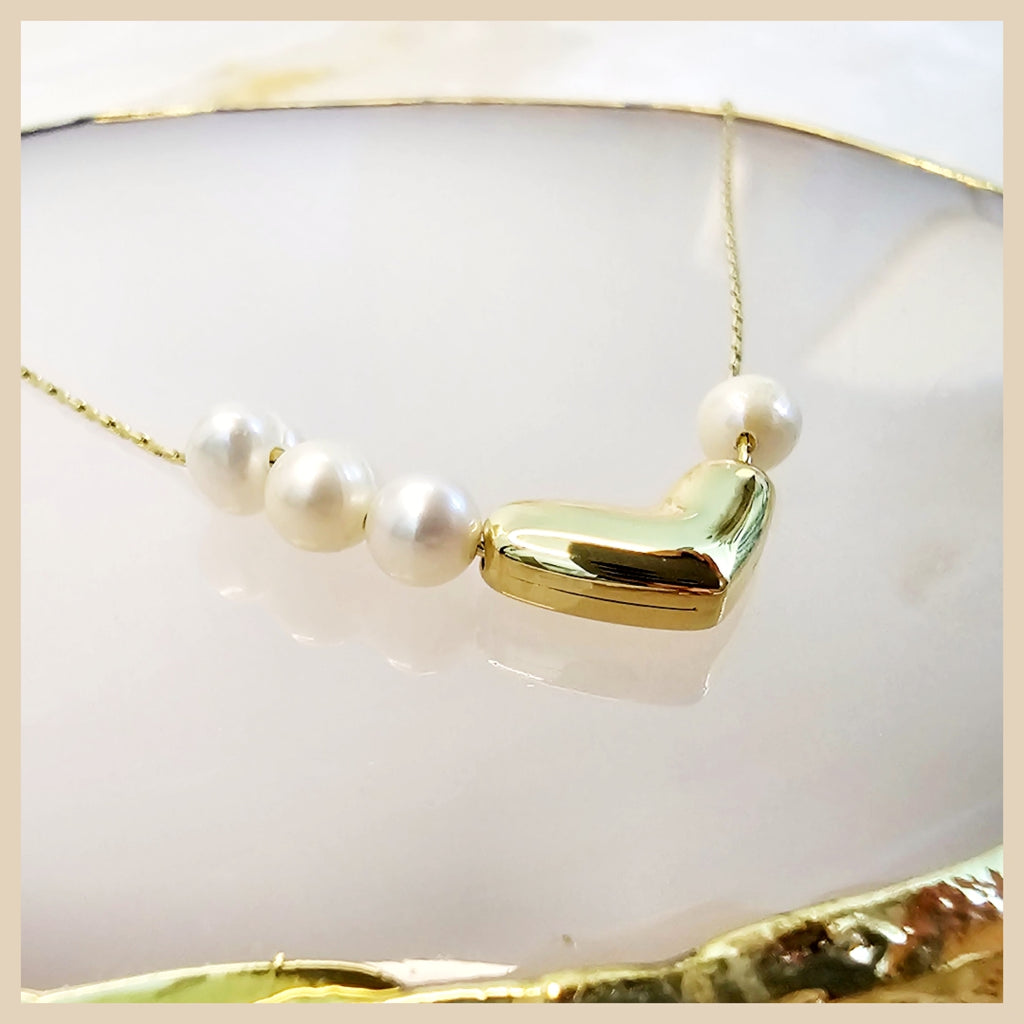 Premium gold plated pearl heart necklace reflecting timeless love and elegance