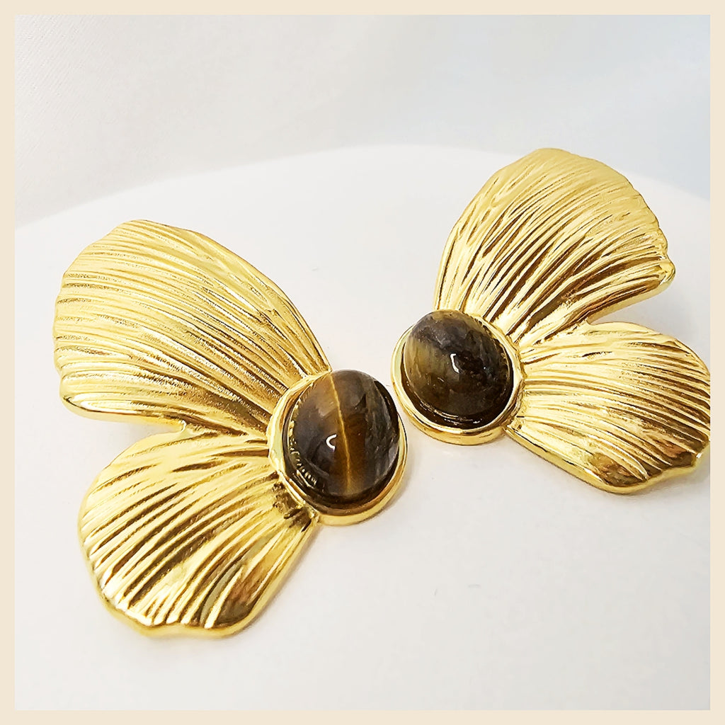 Delicate Leni butterfly hoop earrings in golden shine, perfect for women who love daily luxury jewellery that feels light, modern, and graceful.
