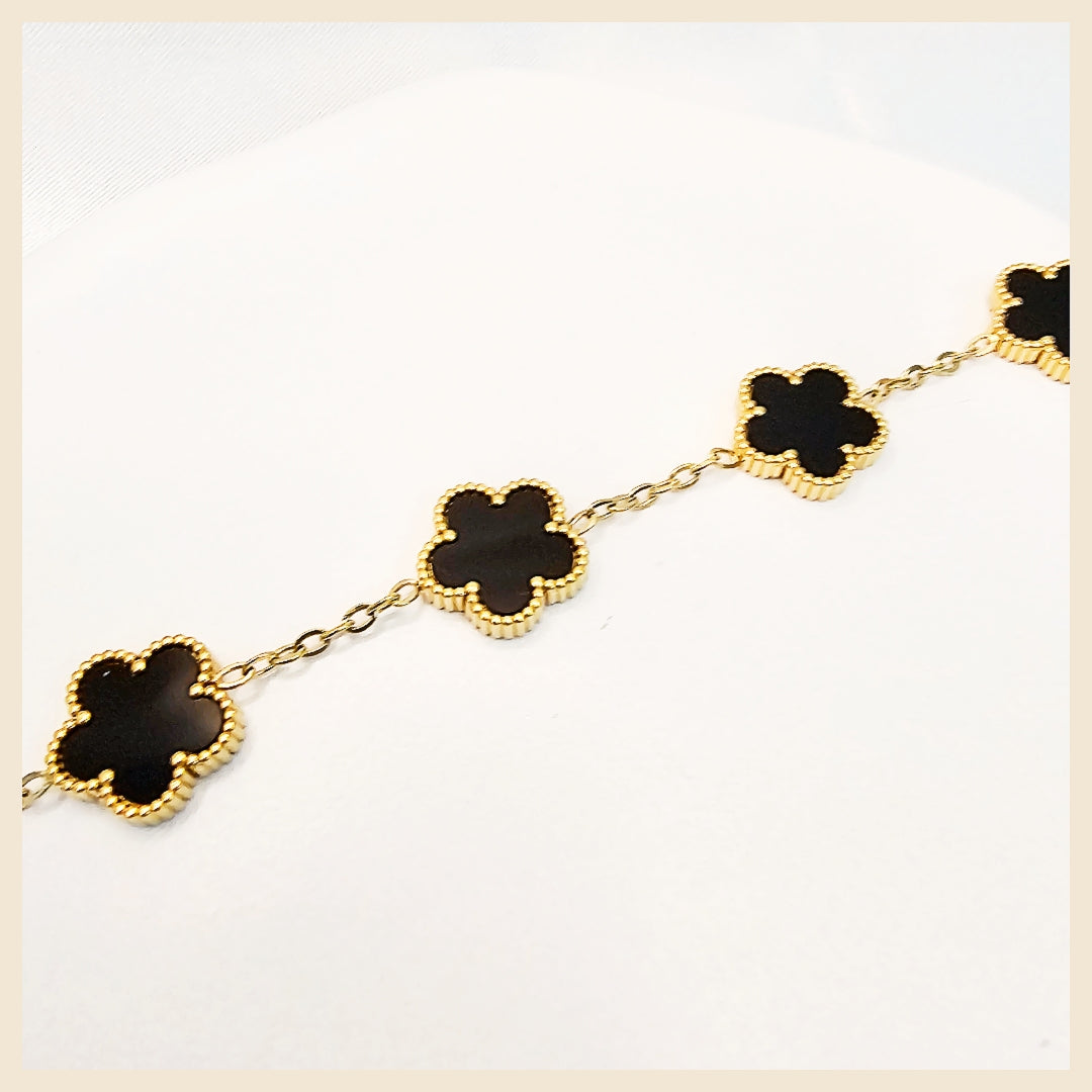 Designer Kiri clover bracelet in stainless steel with openable crystal sparkle, a confident luxury accessory that adds grace, trust, and modern elegance to any look.