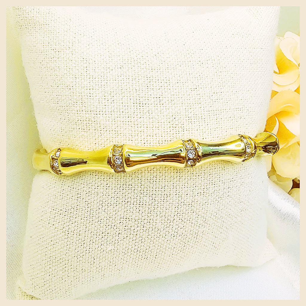 Designer Nori white CZ bangle bracelet in yellow gold-plated finish, perfect for women seeking a traditional fashion look that feels luxurious and photo-ready.