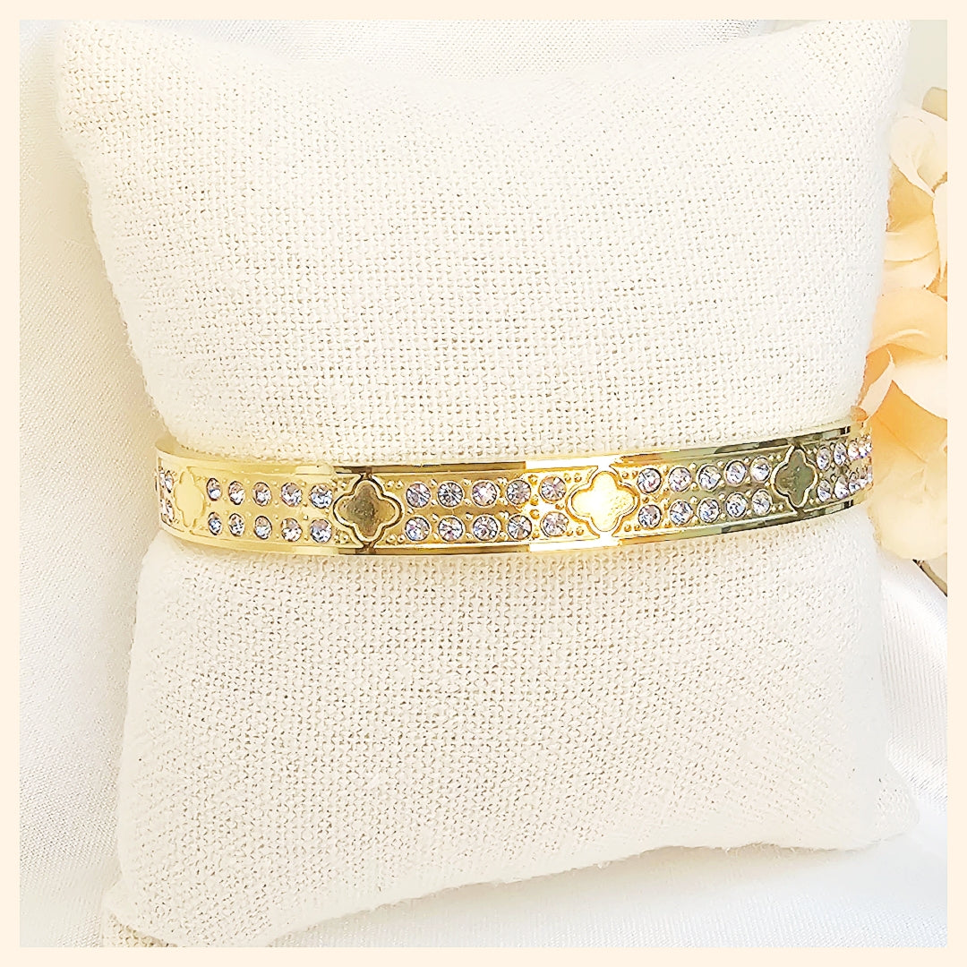 Durable titanium steel gold bangle with brilliant zirconia stones, created for women who desire long-lasting luxury jewellery that maintains its shine through daily wear.