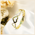 Elegant Beri heart bangle bracelet for her, a timeless gold-plated accessory that makes gifting feel special with a premium, romantic touch.