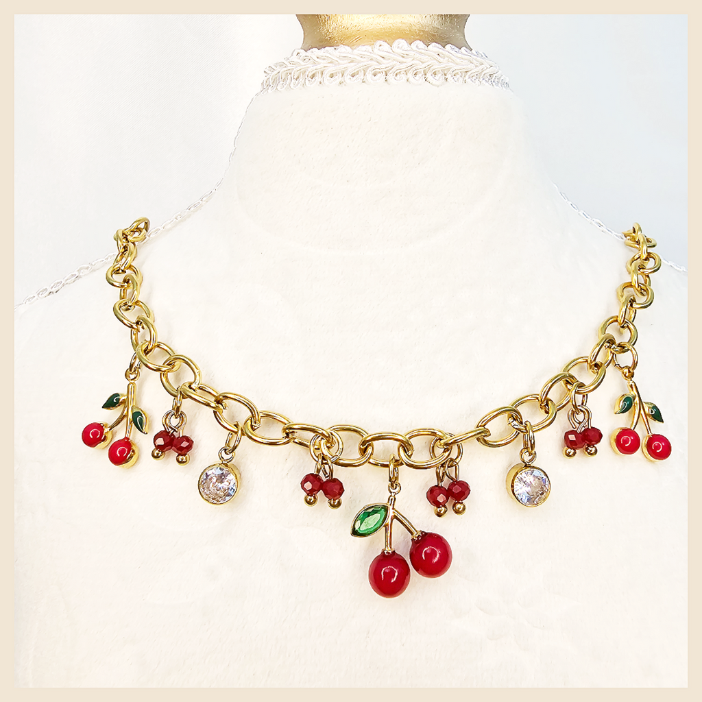 Elegant Bina golden cherries necklace, a fashionable pendant piece that adds soft sparkle and confident charm to both casual and dressed-up outfits.
