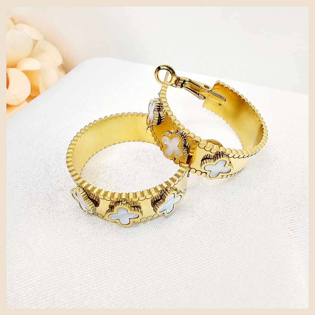 Elegant Dana four-leaf clover crystal hoop earrings, perfect for women who love minimalist fashion jewellery with a luxurious, photo-ready shine.
