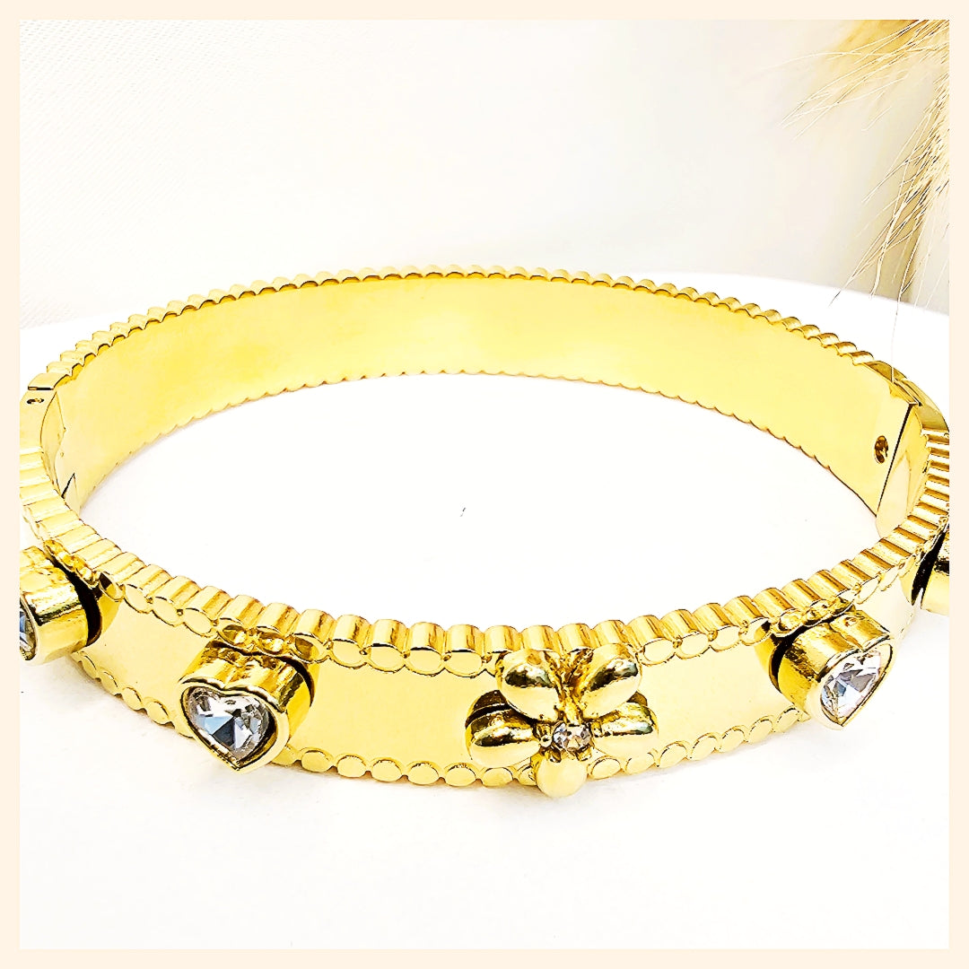 Elegant flower crystal bangle bracelet with polished gold tones, ideal for women seeking refined beauty and timeless jewellery appeal.