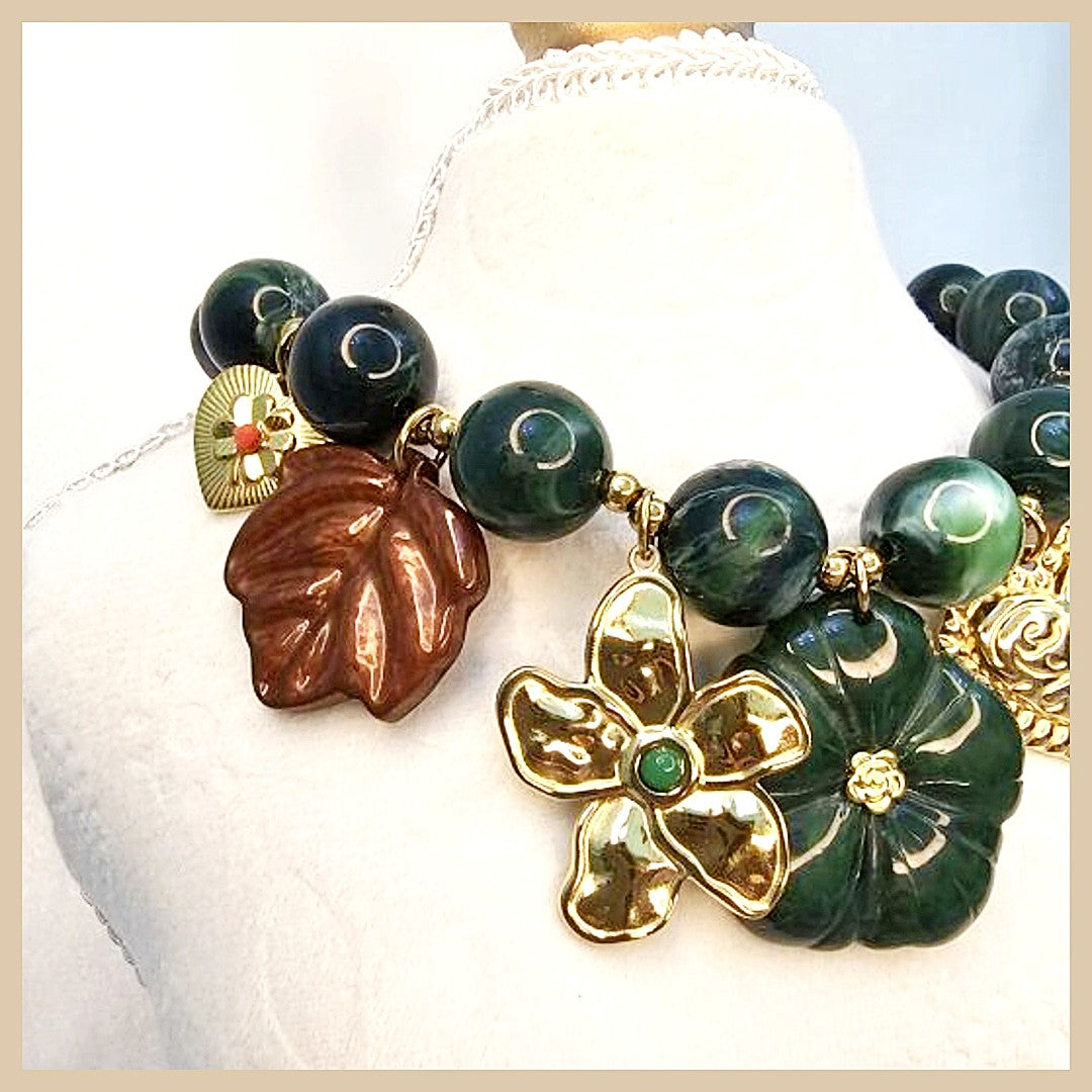 Close-up of green garnet infinity necklace crafted in 18k gold for modern women