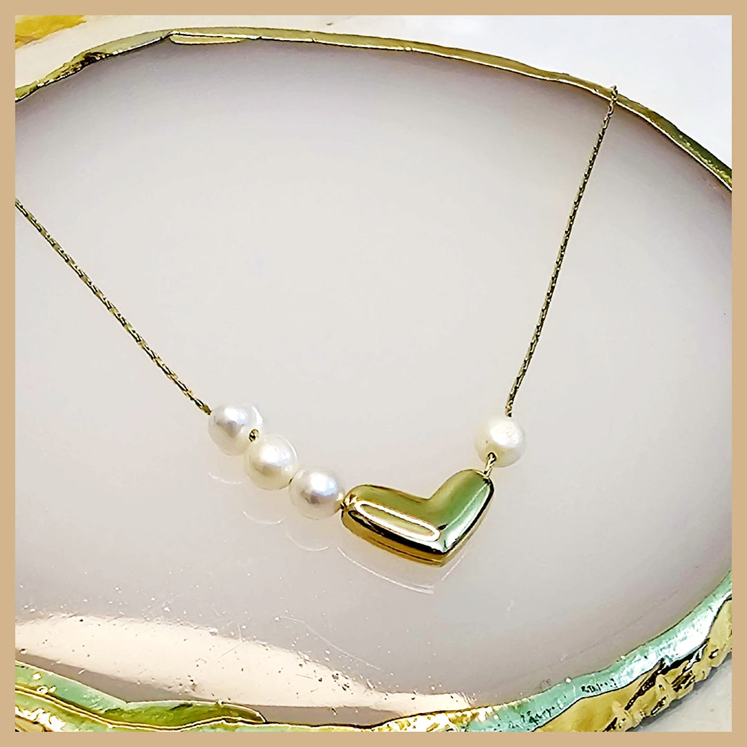 Gold heart necklace with pearl detail created for love-inspired occasions