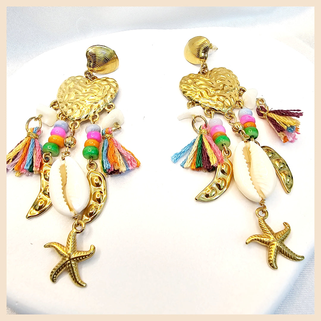 Elis starfish drop earrings with blue crystal detail, designed for women who want a versatile daily-wear piece with a fresh, feminine holiday feel.