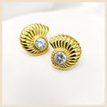 Emil shell stud earrings with an ocean-inspired design, offering a premium 18K gold-plated shine that elevates confidence from day to night.