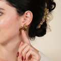 Enna half flower earrings in a Korean-style butterfly and petal half hoop design, created for women who love delicate luxury and soft feminine charm in the UAE.