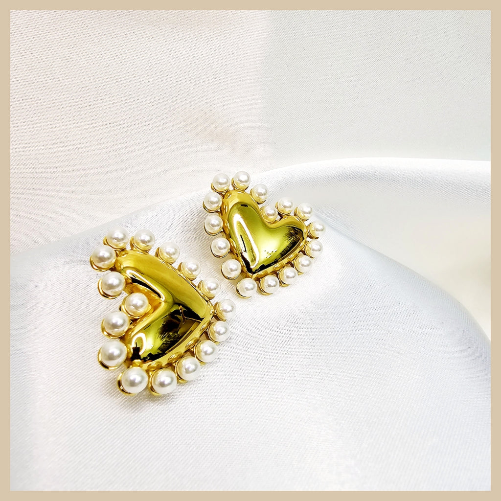 Fara imitation pearl heart drop earrings in gold tone, perfect for women who want a refined touch of romance for dinners and special occasions.