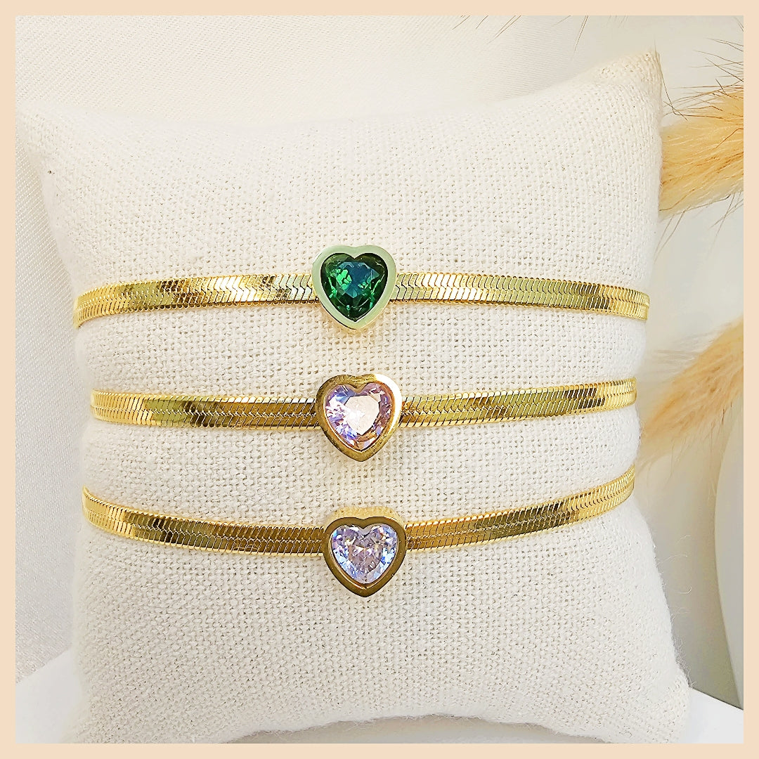 Fashion-forward white gold heart bracelet shown in a lifestyle street setting, projecting confidence, modern taste, and a statement accessory for urban women in the UAE.