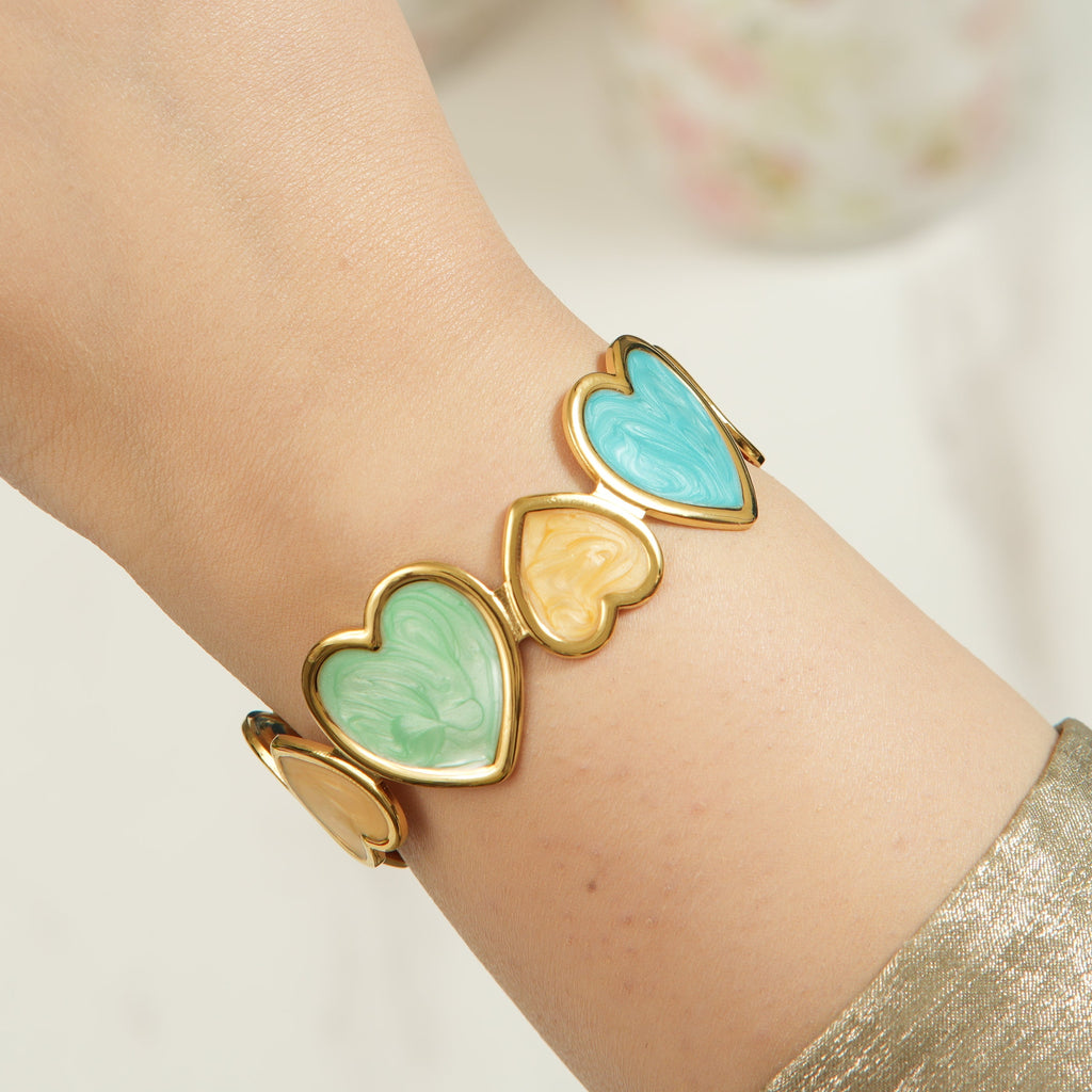 Geni hearts open bangle 6-piece multi-layer stackable hand chain set, perfect for women who love a curated bohemian look for UAE day-to-night wear.