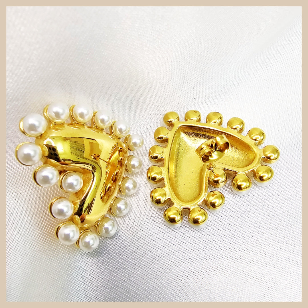 Fara gold color heart pearl dangle earrings, a beautiful choice for anniversaries or Valentine’s gifting that feels elegant and thoughtfully chosen.