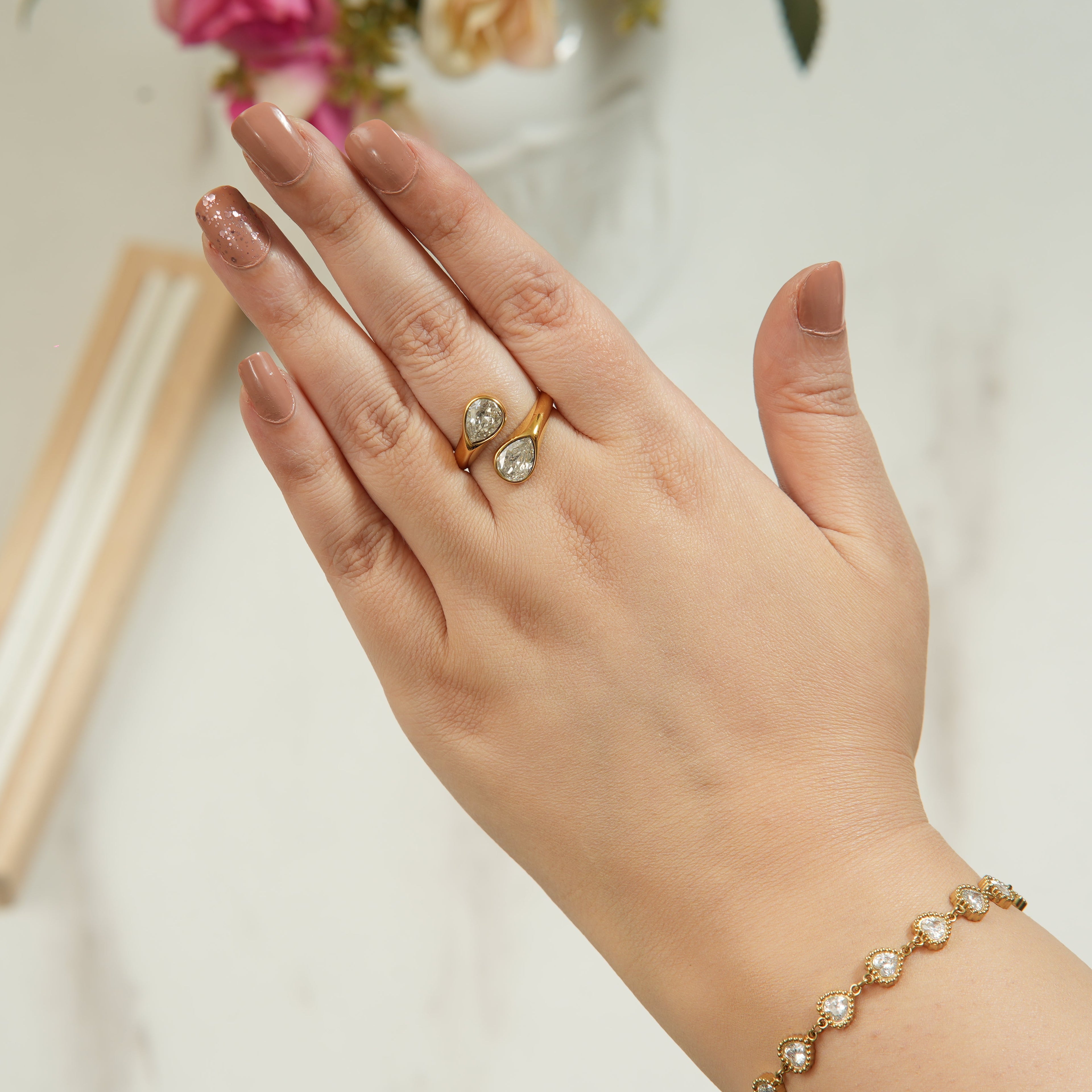 Huna Drop Zircon ring with a double water drop design in sterling silver, a refined women’s wedding gift that adds graceful sparkle and elegant confidence in the UAE.