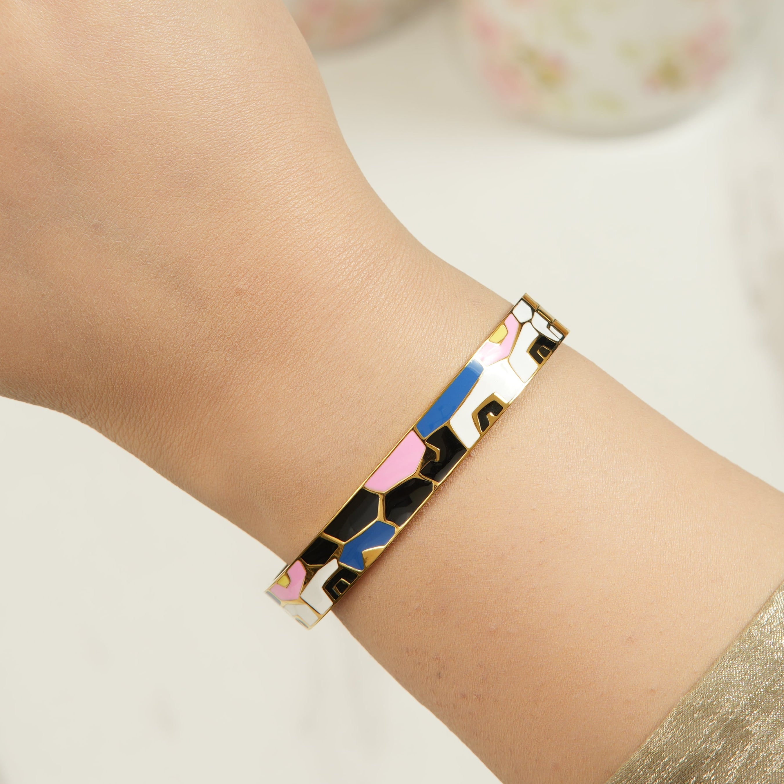 Jada enamel alloy bangle in multicolor finish, featuring CZ detailing for a polished, premium look that feels effortlessly stylish on the wrist.