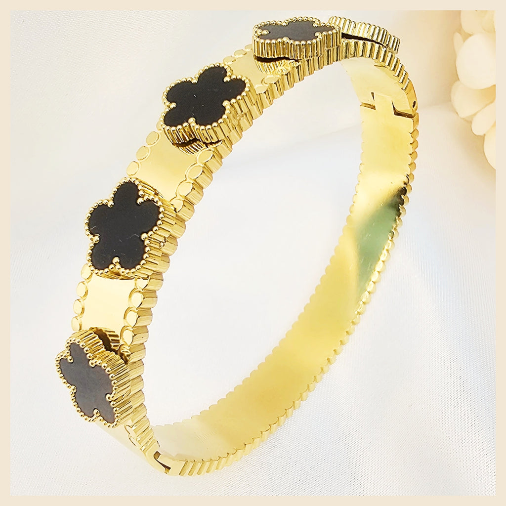 Keia petal clover 18K gold-plated crystal bangle with an openable stainless steel design, created for women who want secure luxury sparkle in the UAE.
