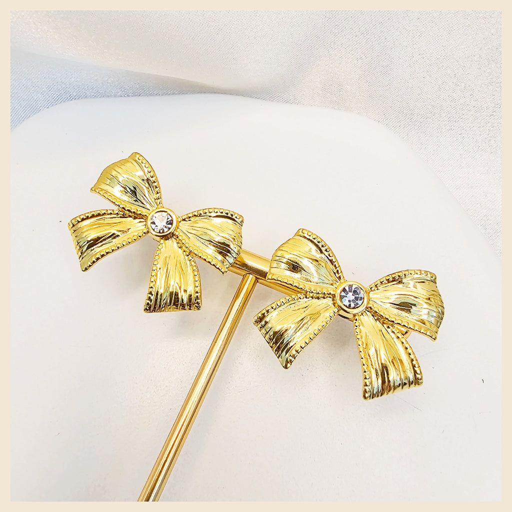 Lala silver crystal bow earrings with delicate rhinestone detailing, created to bring soft glamour and polished confidence to everyday and evening looks.