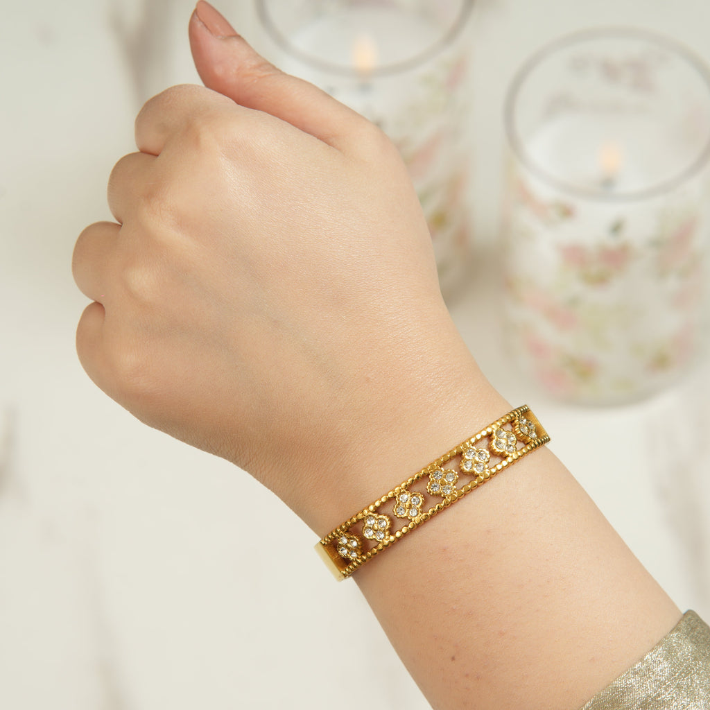 Leja crystal zircon bangle in 18K gold-plated finish, a sleek open cuff style that adds elegant sparkle to day-to-night outfits in the UAE.