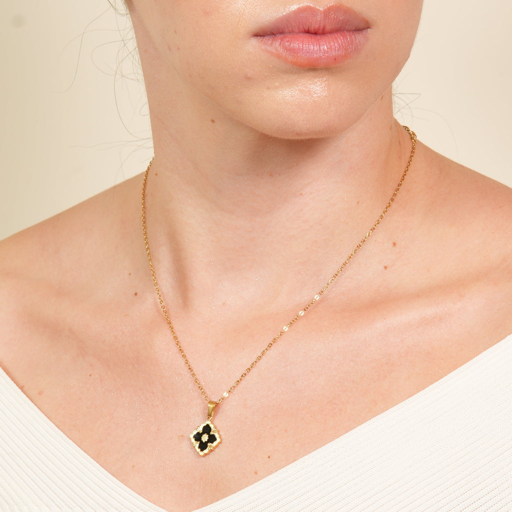 Lura black five-leaf clover jewellery set in 18K gold-plated finish with necklace, earrings, and bracelet, crafted for women who love luxury coordination and refined shine.