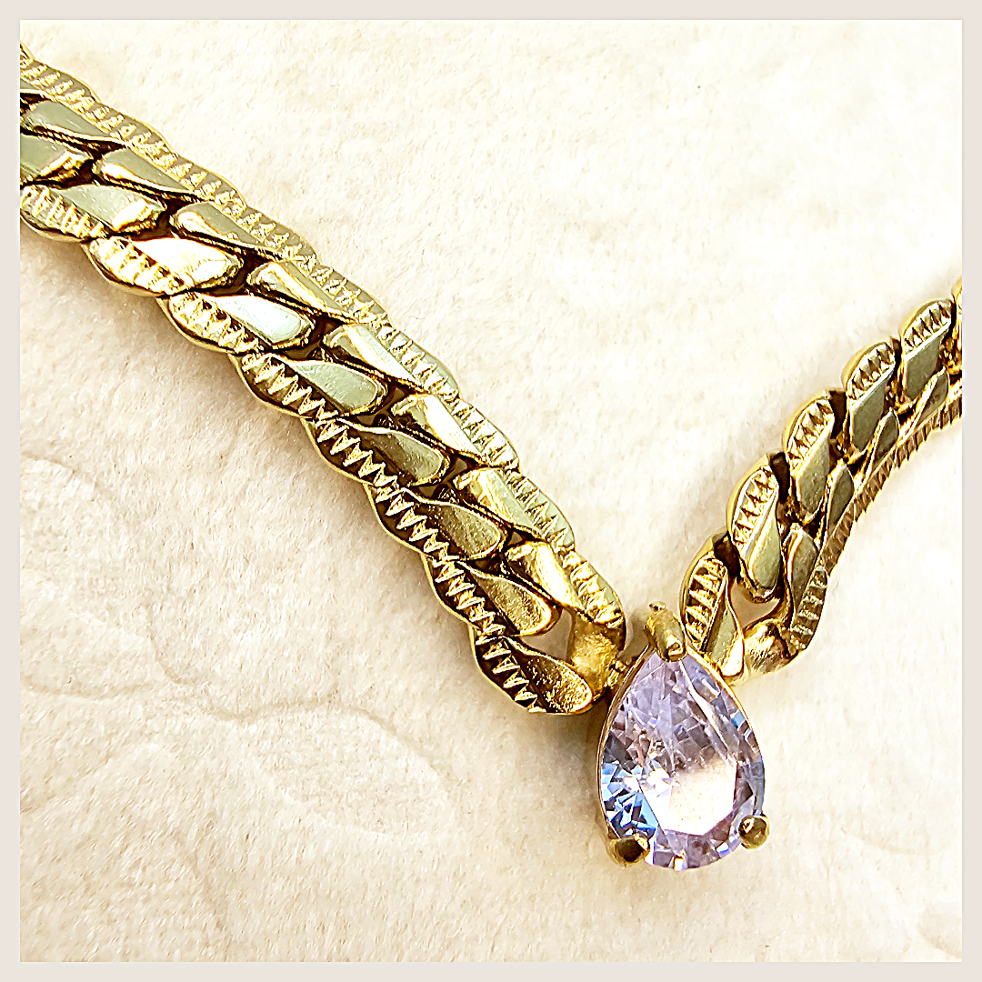 Luxury Amya teardrop charm necklace with blue CZ, designed for women who appreciate exclusive jewellery with refined brilliance.
