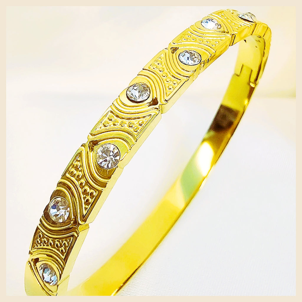 Luxury zircon bangle cuff with multitone detailing, crafted to elevate festive outfits with confidence and refined beauty.