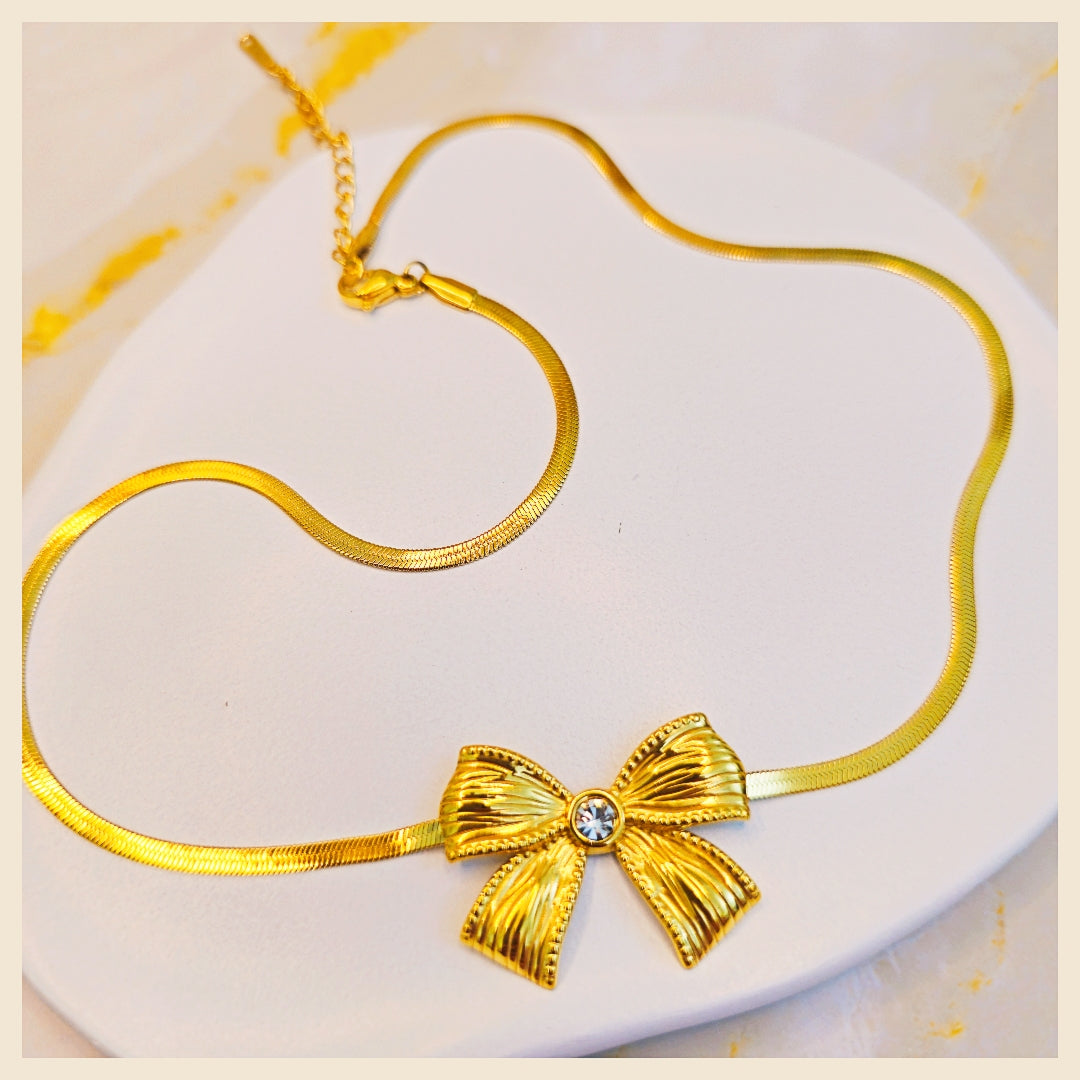 Modern Lala bow stone pendant necklace in gold-plated style, designed to elevate casual outfits with a feminine, fashion-forward touch.