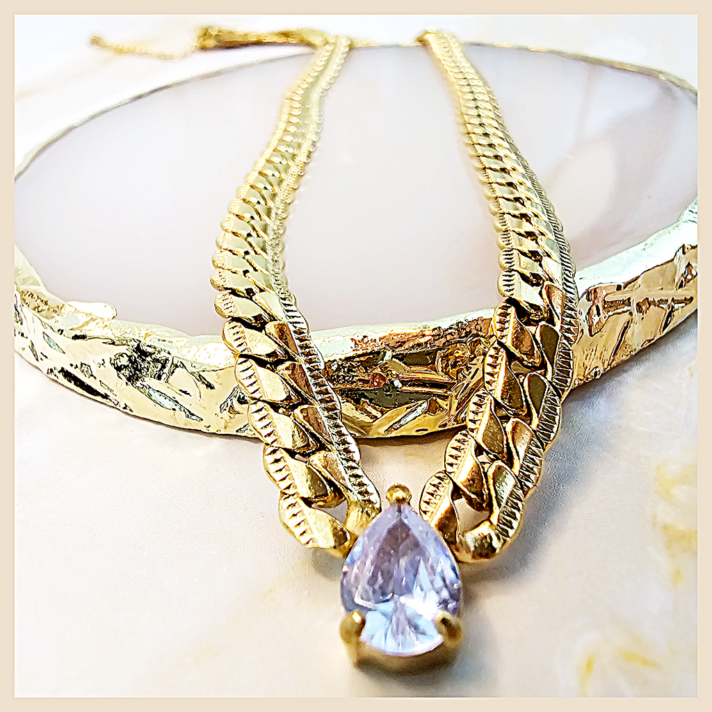 Noble Amya teardrop necklace featuring a blue CZ pendant, perfect for women who want refined luxury for formal occasions in the UAE.