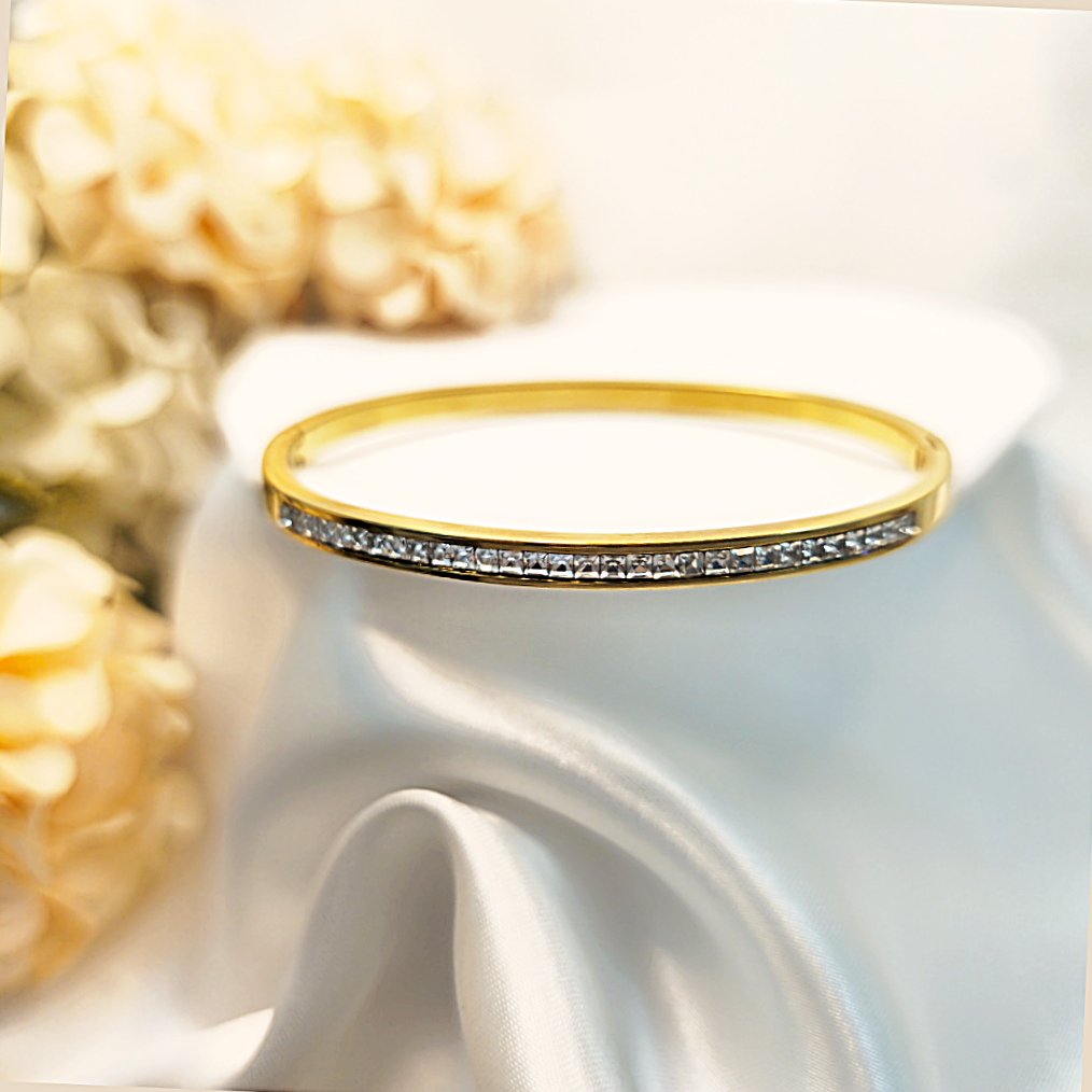 Premium Alma cubic zirconia crystal bangle in gold-tone style, crafted to feel gift-worthy and beautifully radiant for special moments.