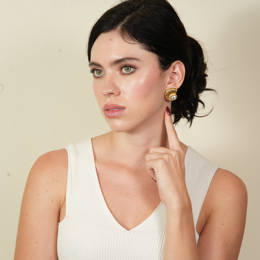 Premium Emil shell-shaped stud earrings in stainless steel with 18K gold-plated finish, designed for women who want long-lasting elegance and trusted quality.