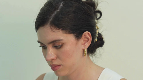 Arla sterling silver Mobius twist hoop earrings for women, a lightweight pair that feels comfortable all day while adding refined shine and confidence.
