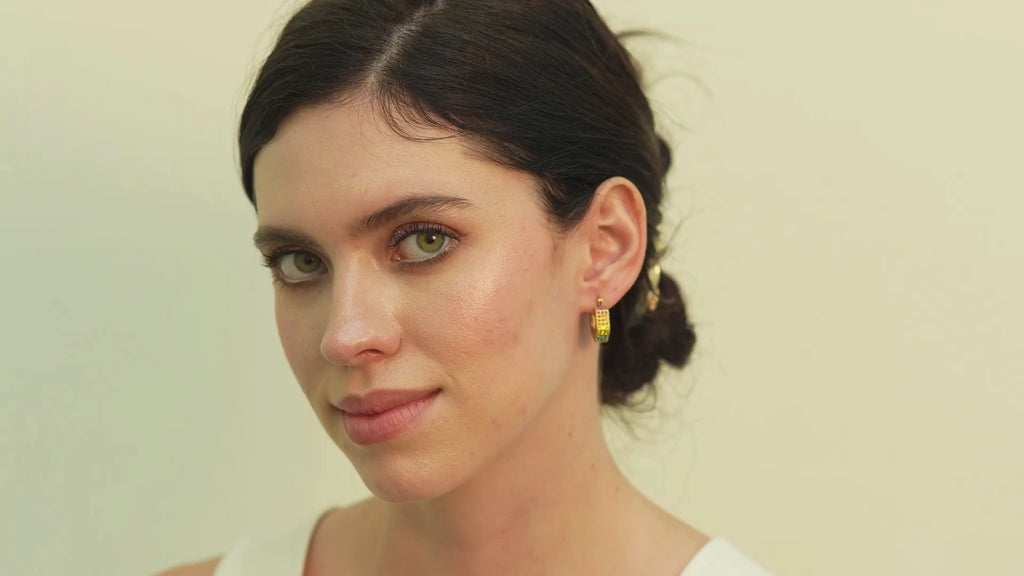 Modern Fana black enamel CZ hoop earrings, inspired by Dubai-style fashion for women who appreciate bold contrast with a feminine, polished glow.