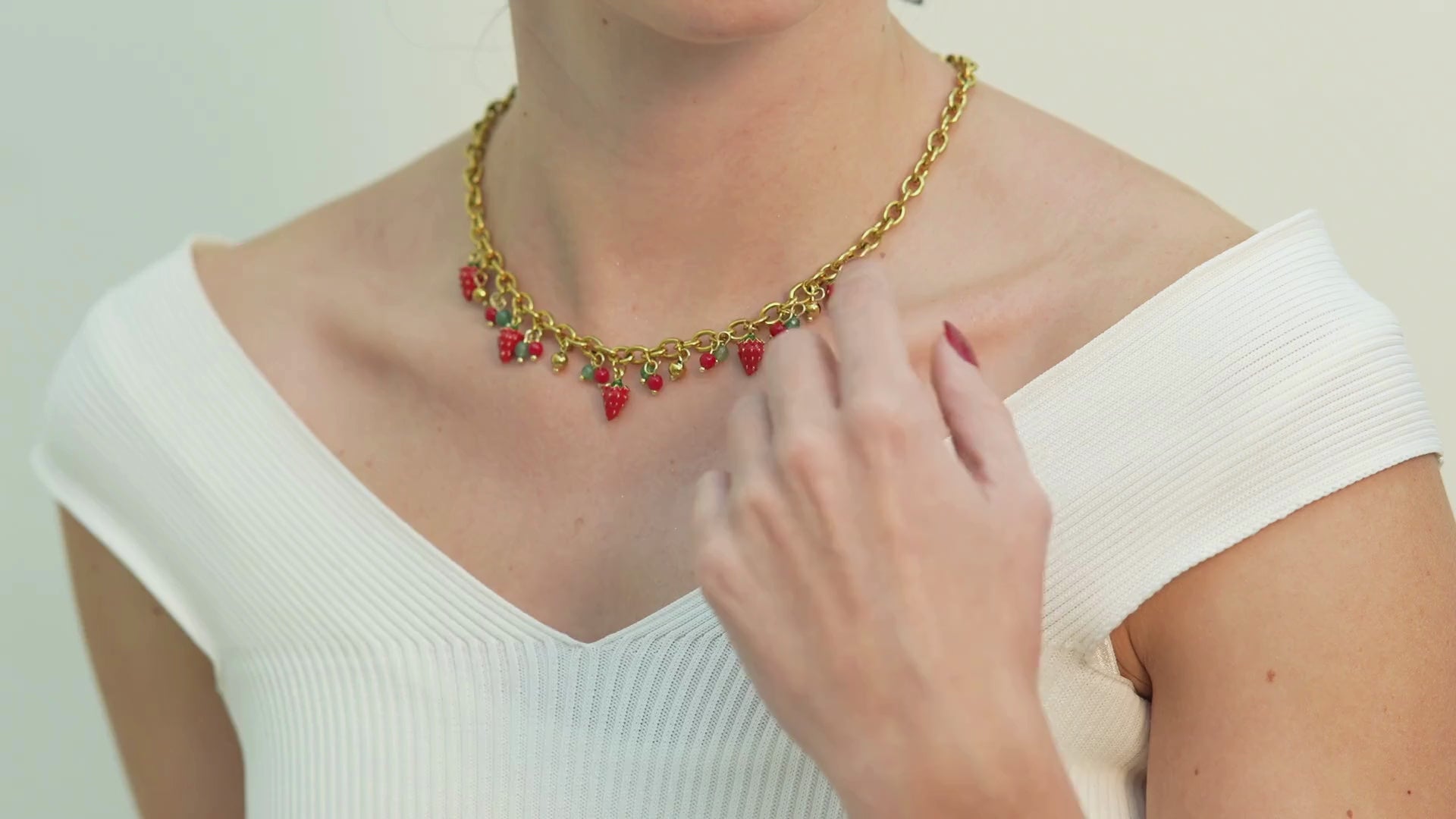 Elegant red strawberry and pearl bow pendant necklace crafted for women in Dubai seeking a charming yet sophisticated statement piece.