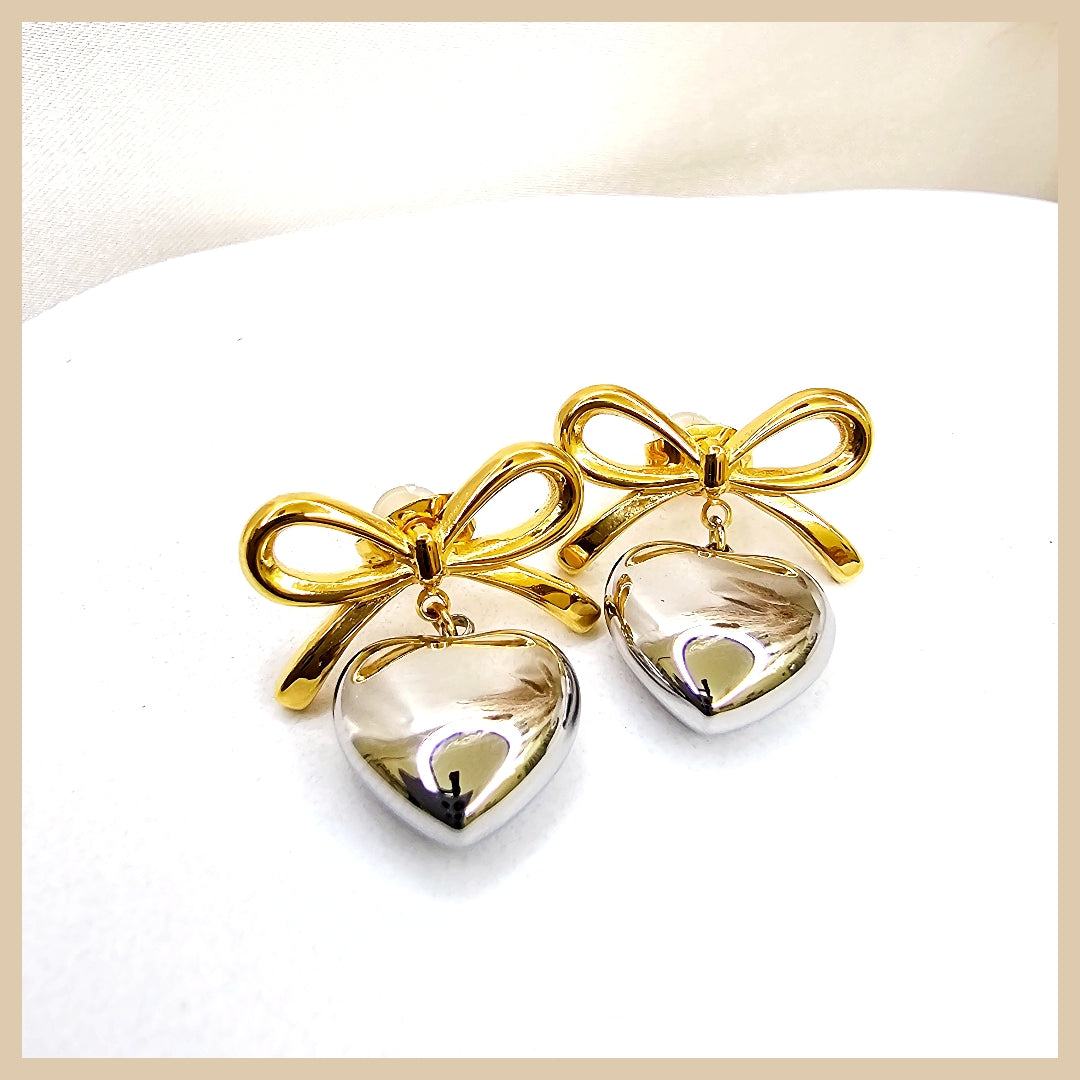 Romantic heart earrings with bow detailing, ideal as a Valentine’s or anniversary gift that expresses affection through refined, colourful design.