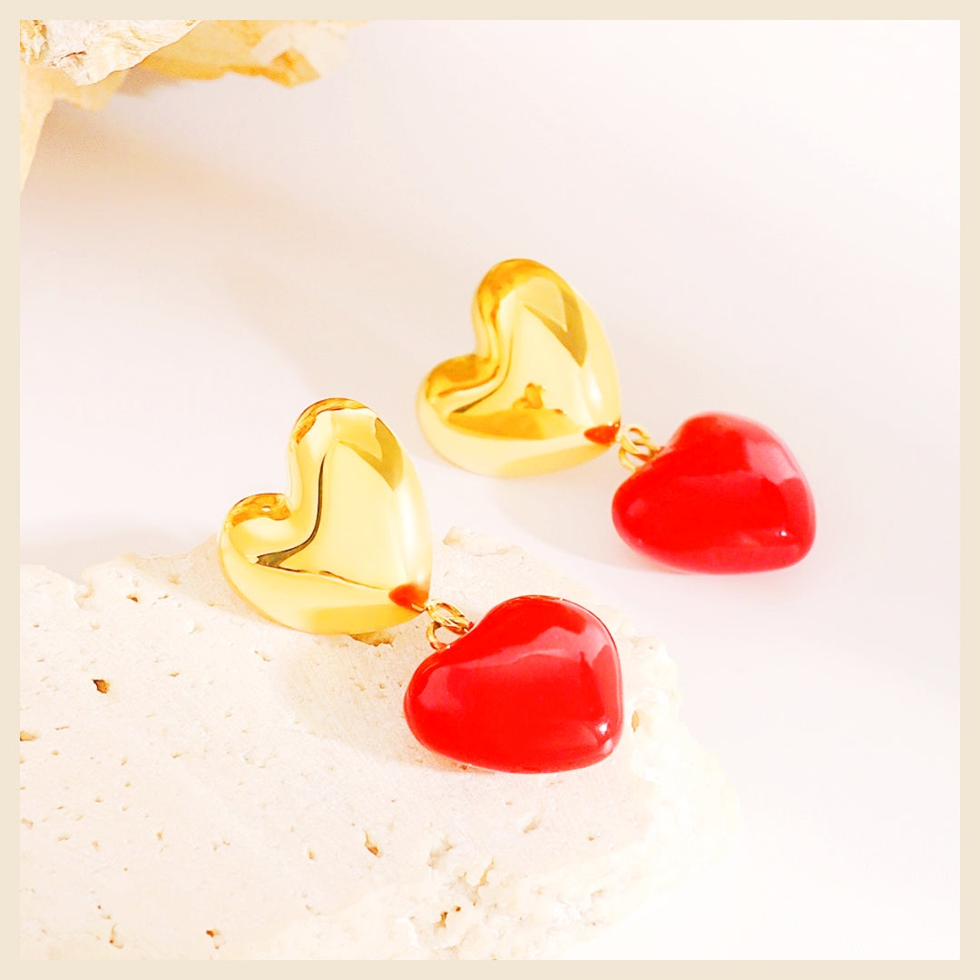 Glamorous red heart earrings showcased in a premium gift box, designed to make a memorable present for her on special occasions or festive celebrations.
