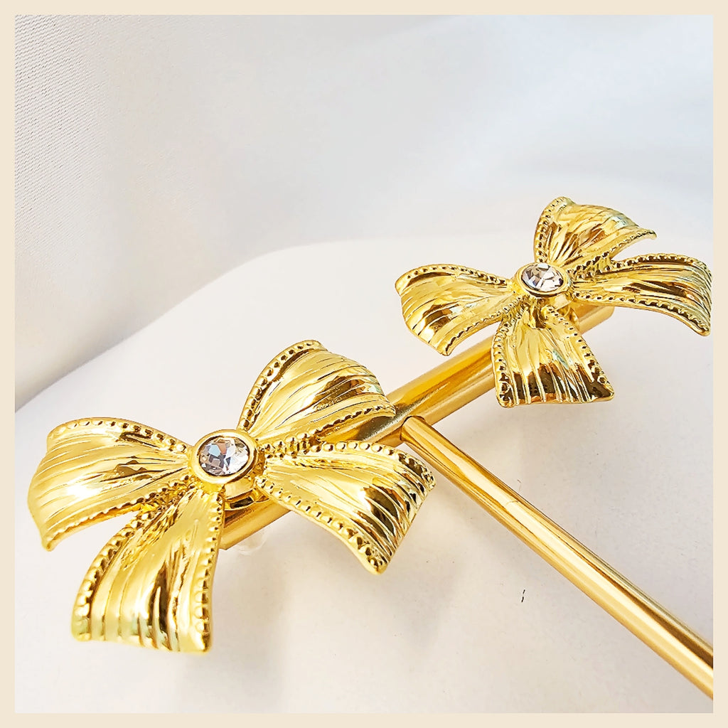 Sparkling Lala bow stone earrings in a silver bow tie drop design, perfect for women who love elegant details that feel gift-worthy and refined.