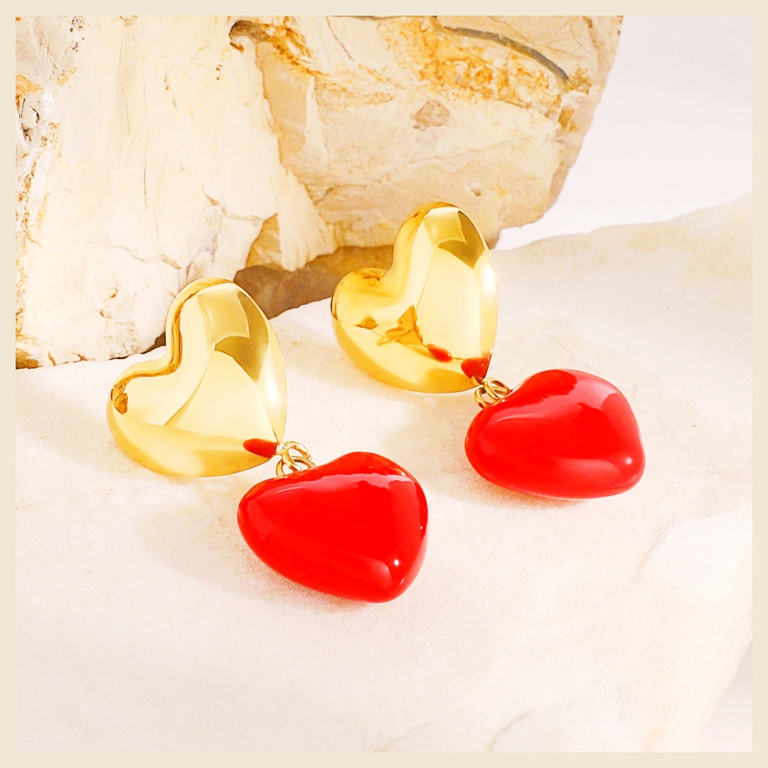Festive red heart earrings ideal for Eid or Valentine’s gifting, offering warm gold tones and joyful colour that resonate with emotional, trusted presents.