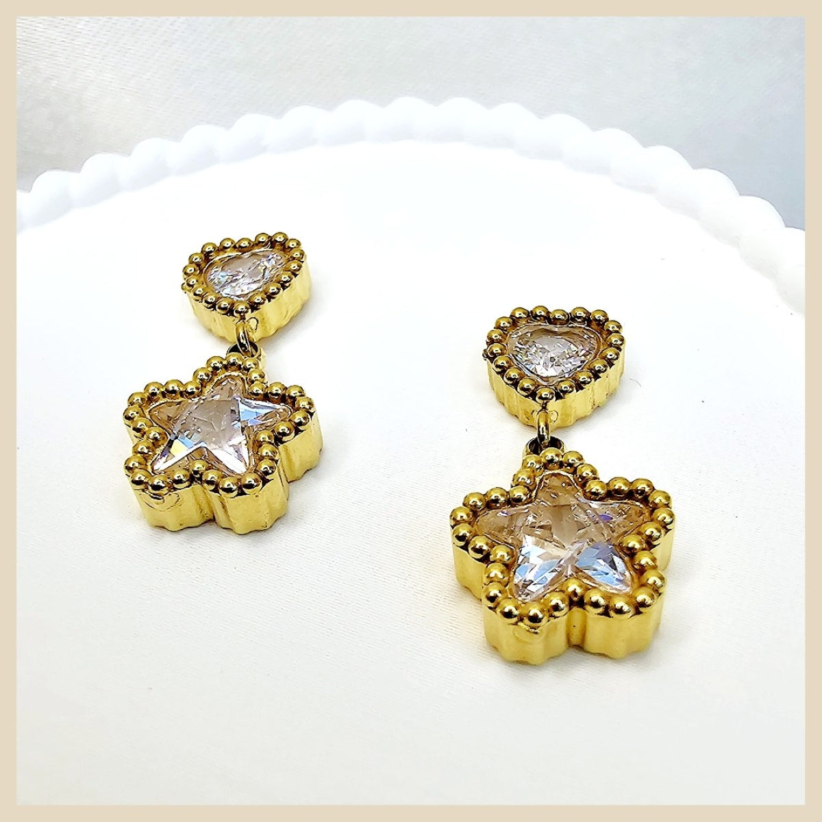 Trendy Eyla sparkle star earrings in a gold hoop design, perfect as a friendship gift for women who love playful luxury and standout style.