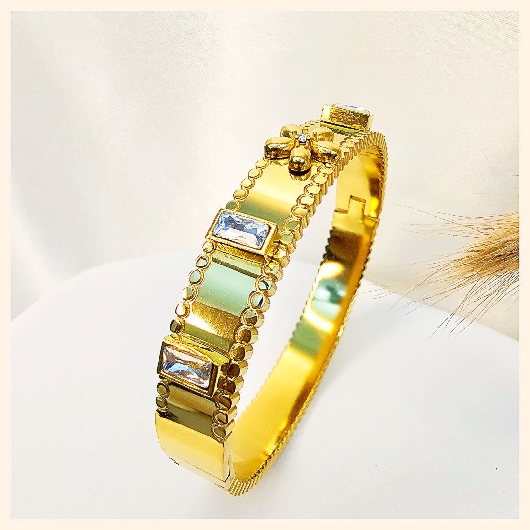 Twisted open cuff bracelet in gold, styled for Dubai fashion lovers who appreciate clean design, versatility, and confident everyday elegance.