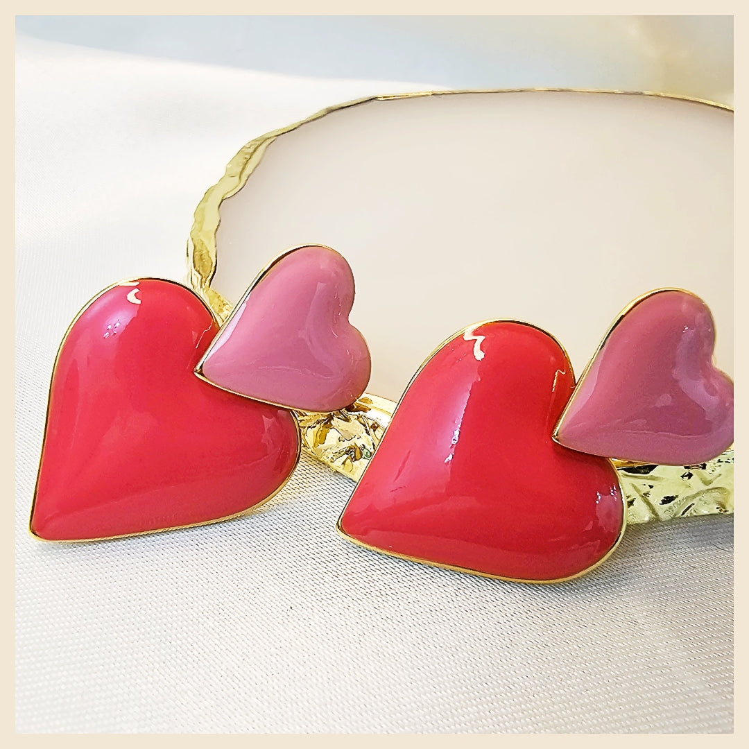 Heart swing earrings in polished gold, styled for UAE women who seek chic, modern accessories that elevate both workwear and evening looks.