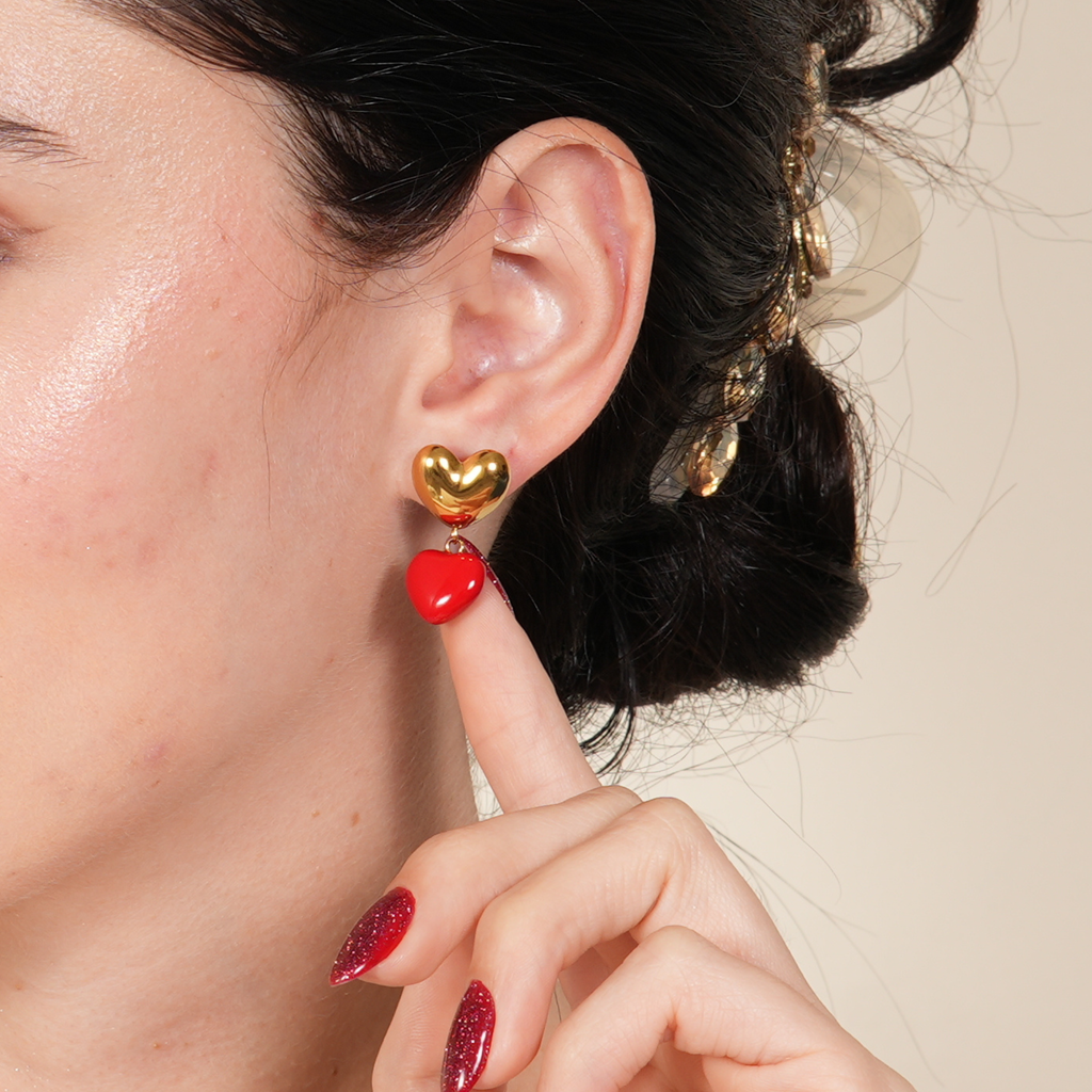 Red rhinestone heart dangle earrings in gold, styled for Valentine’s Day in the UAE to deliver a bold, romantic sparkle that feels both luxurious and exciting.